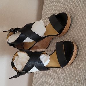 Gently used wedge sandals in black